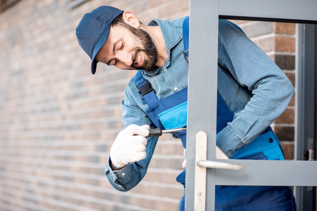 Builder Installing Door Lock 1